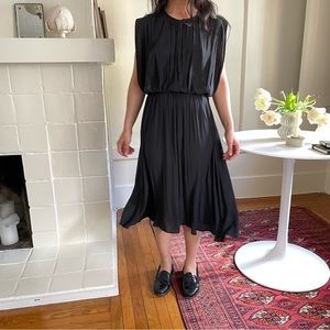 Black dress with button closure at neck
